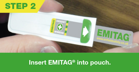Emitag being inserted into pouch