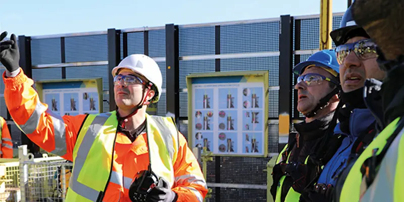 Group of workers wearing safety glasses and ppe